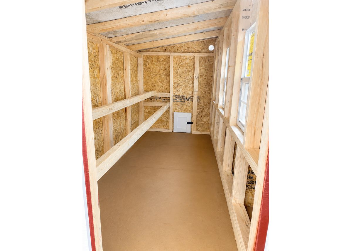 Inside the XL chicken coop with roost bars and windows