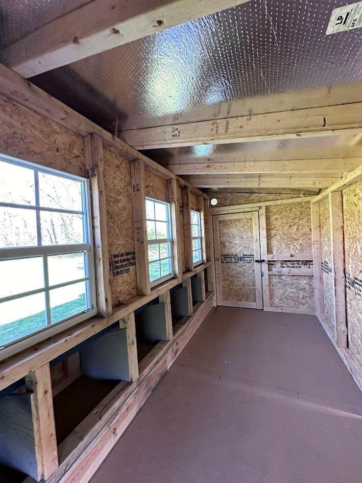 Inside the XL chicken coop with roost bars and windows