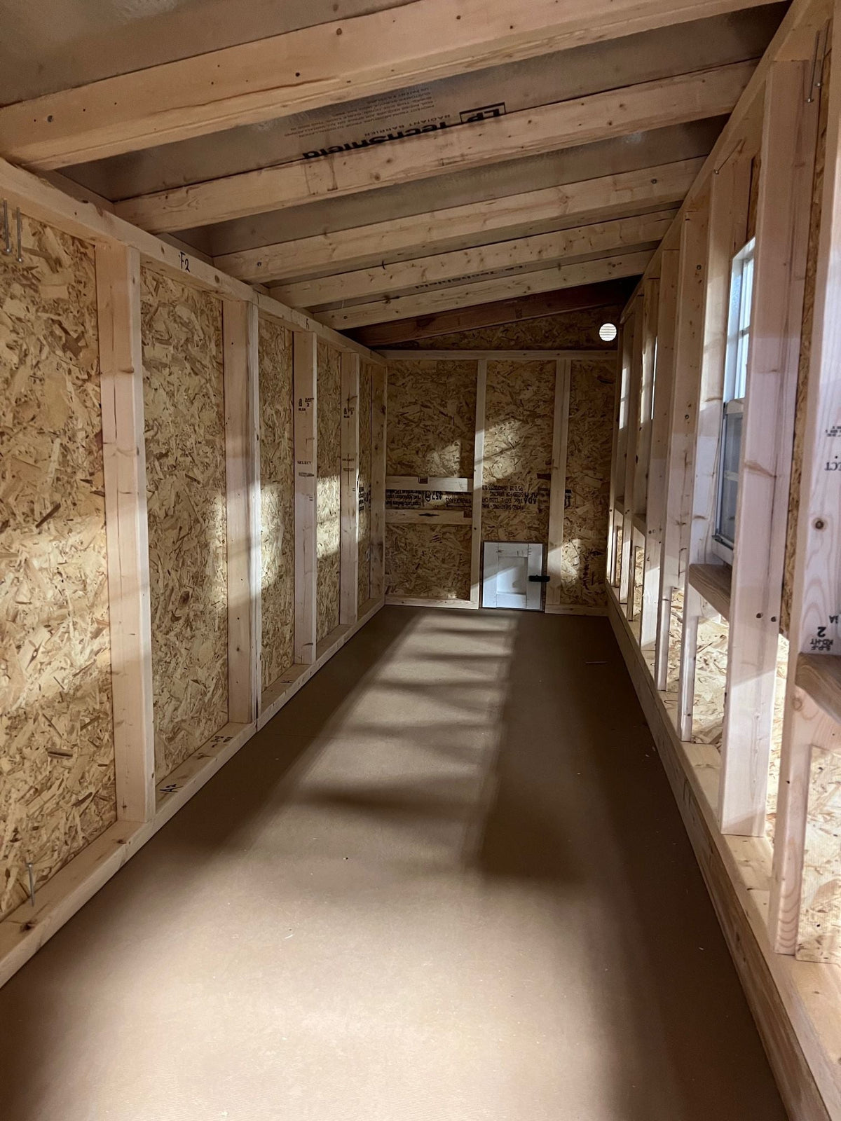 Interior of the jumbo chicken coop with windows