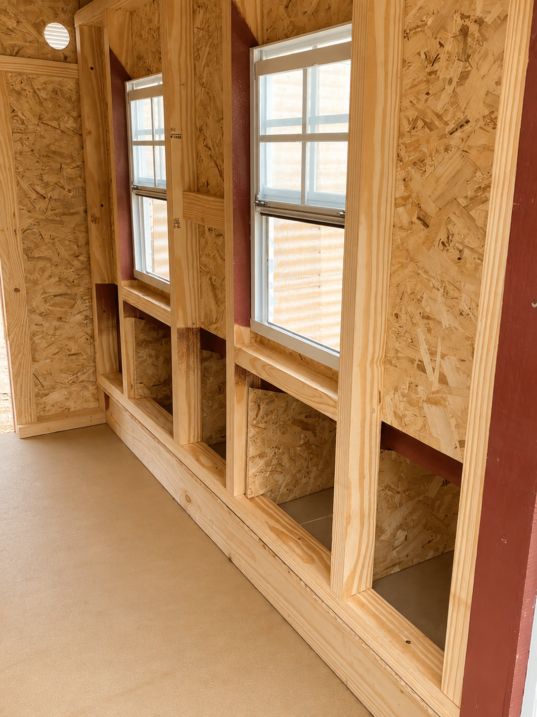 Inside the large chicken coop showing the nesting box openings