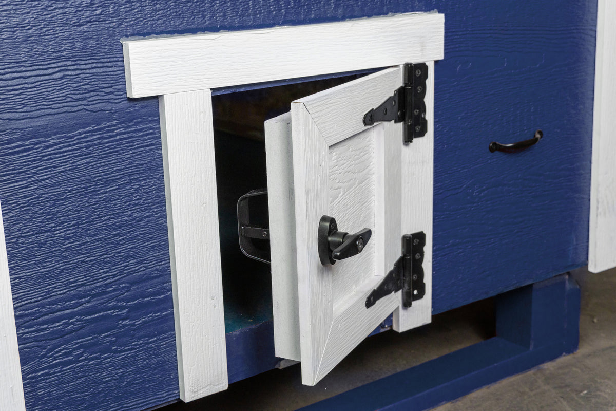 Blue large chicken coop with white trim, close-up of the chicken pop door